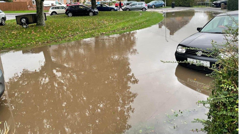 A residential street submerged in water