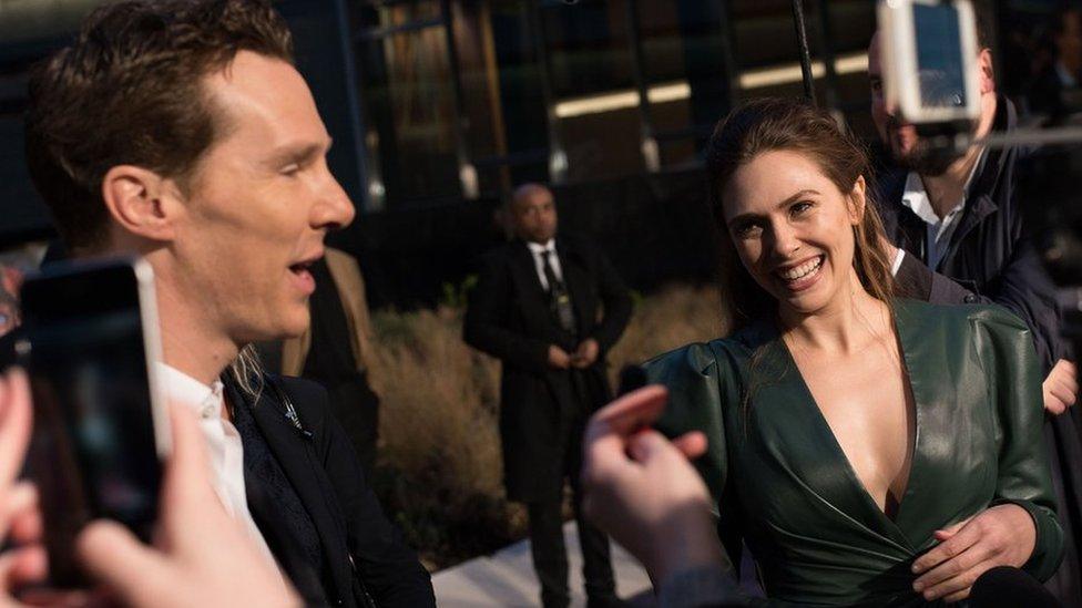 Elizabeth Olsen laughing with Benedict Cumberbatch