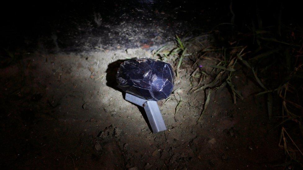 An unexploded bomb lies at the site of an explosion in Dhaka, Bangladesh, Saturday, on 24 October 2015