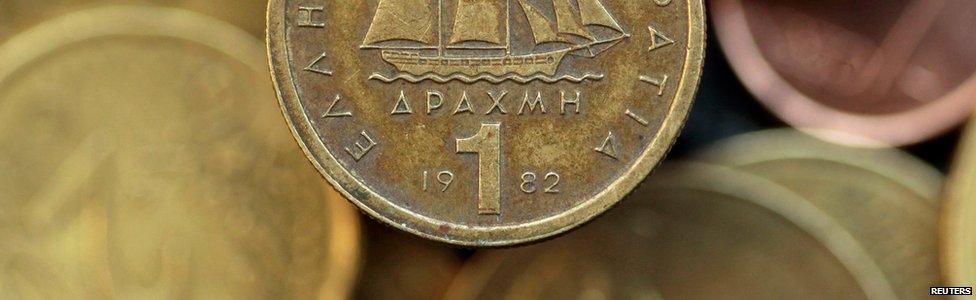 A drachma coin is seen on display in this photo illustration taken in Athens in this May 9, 2012