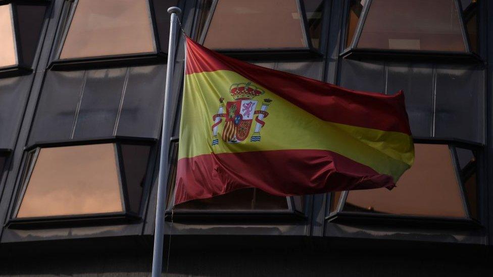 Spain's flag outside a court