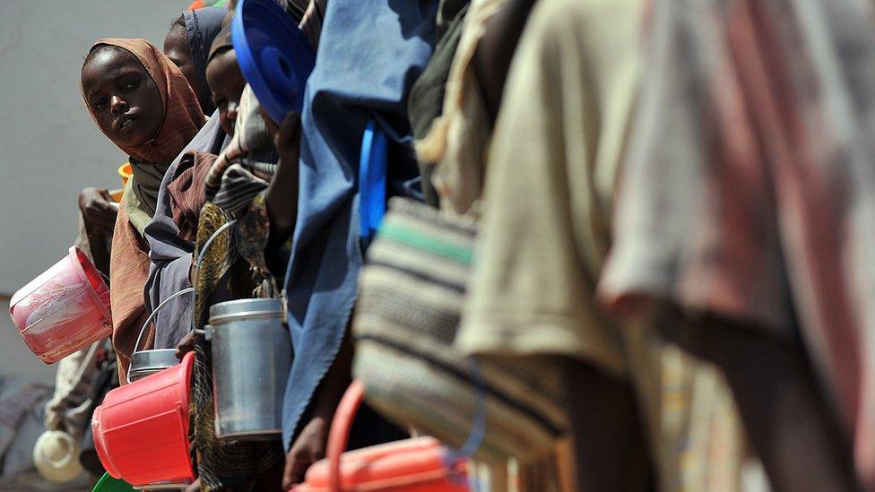 Somalis collecting water at a camp in 2012