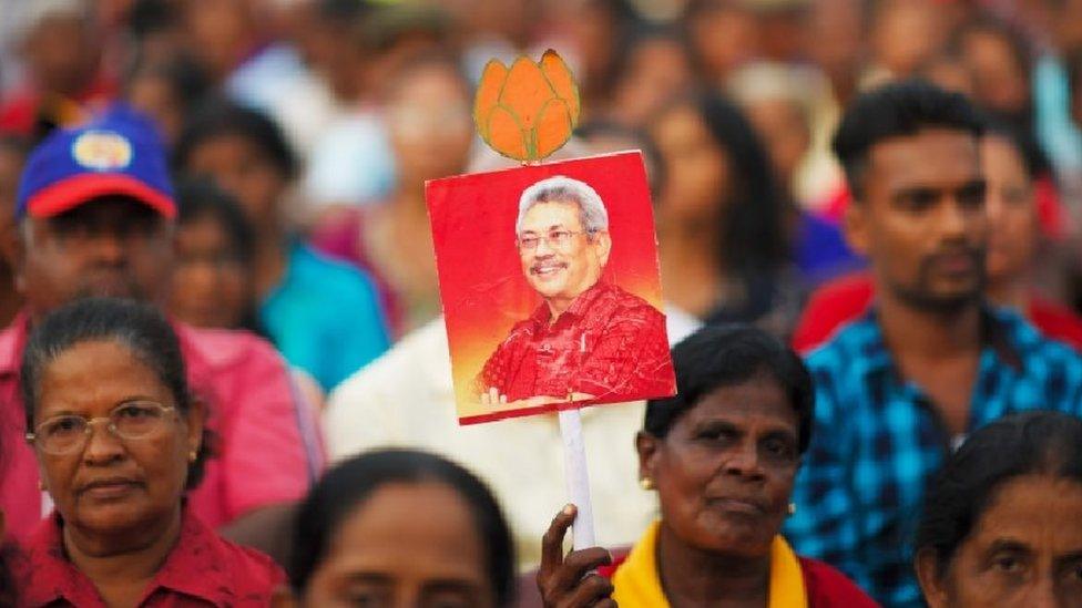 Supporters of Sri Lanka Podujana Peramuna (SLPP) party presidential candidate Gotabhaya Rajapaksa attend a campaign rally in Homagama on November 13, 2019