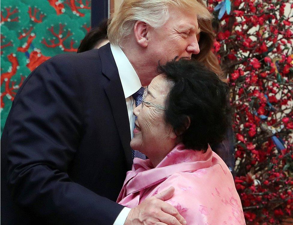 US President Donald J. Trump (L) embraces Lee Yong-soo, a former "comfort woman" who was forced into sexual slavery by Japan's military during World War II, at a state banquet hosted by South Korean President Moon Jae-in at the presidential office Cheong Wa Dae in Seoul, South Korea, 7 November 2017.