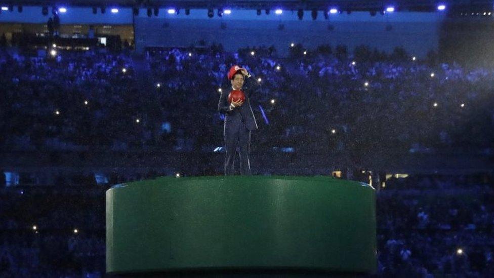 Japan"s Prime Minister Shinzo Abe appears during the closing ceremony in the Maracana stadium at the 2016 Summer Olympics in Rio de Janeiro, Brazil, Sunday, Aug. 21, 2016