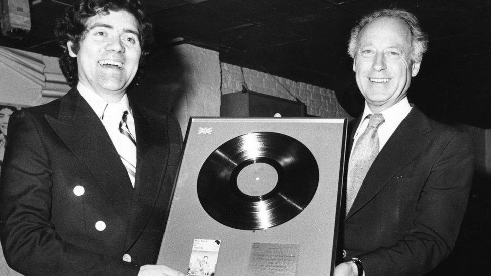 Max Boyce receives a silver disc for his album 'Live at Treorchy' from record industry bosses