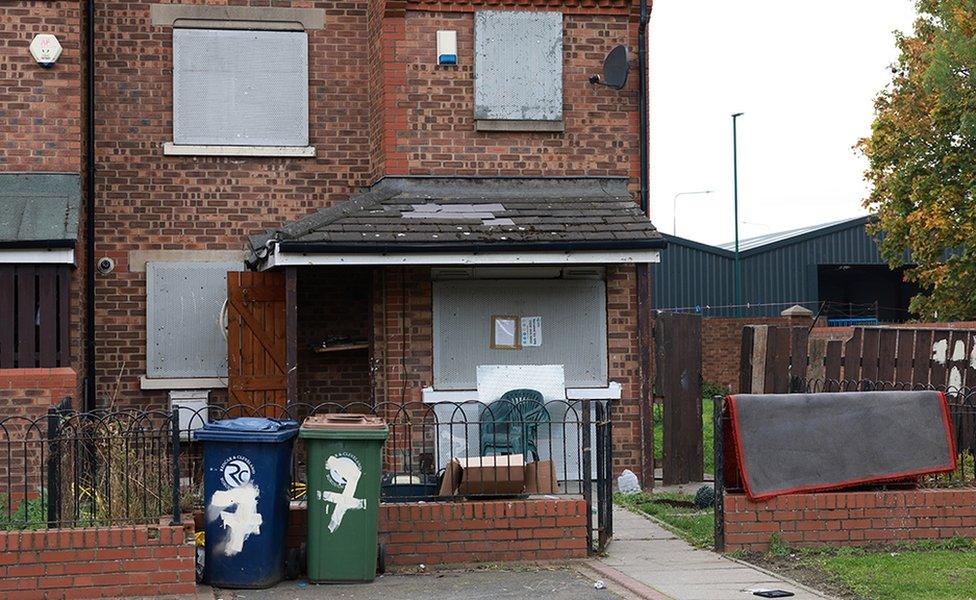 Image of property in St James Court, Grangetown which was subject to a closure order by magistrate showing rubbish and boarded up windows