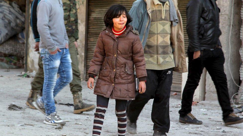 A girl mourns the loss of her relatives after air strikes by pro-Syrian government forces in the rebel-held Saliheen district of Aleppo (8 February 2016)