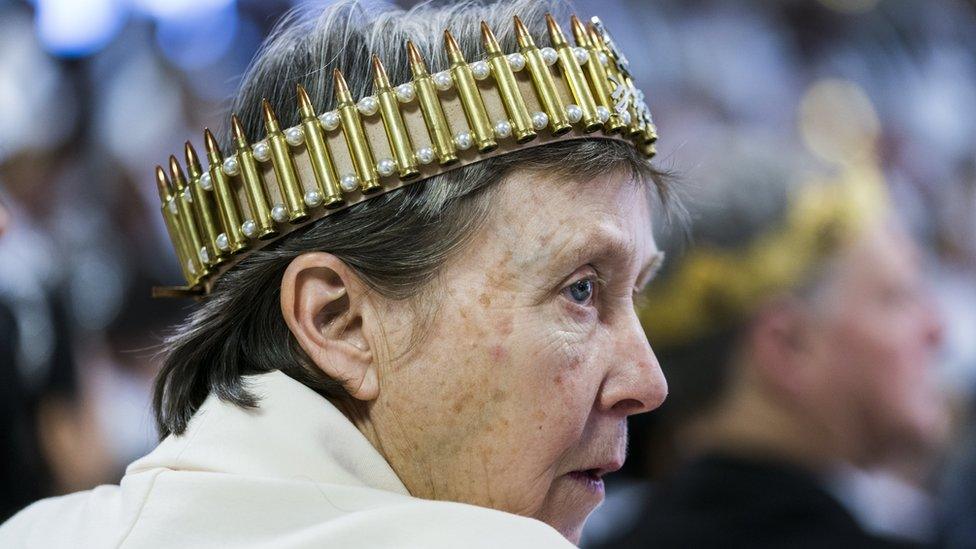 A parishioner with the Sanctuary Church wears a crown of bullets