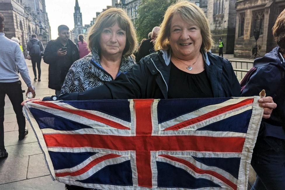 Linda Greenshields and flag