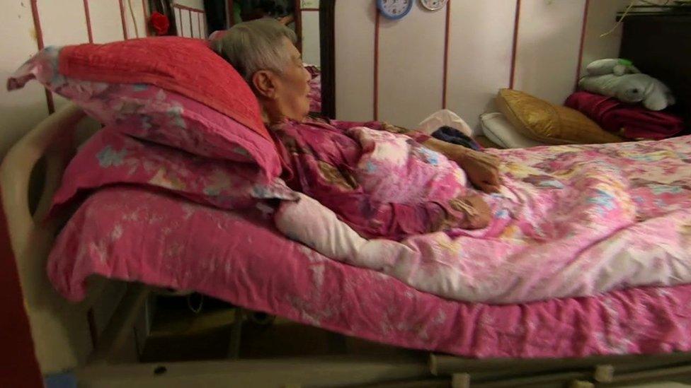 Elderly woman in bed