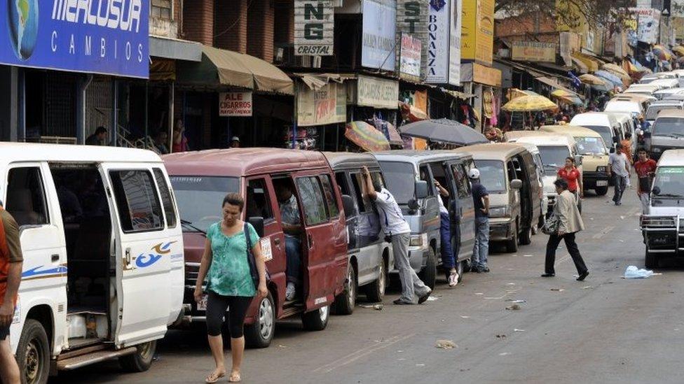 Private microbuses wait for Brazilians from Foz do Iguacu, while they do their shopping in Ciudad del Este, Paraguay, 11 September 2010.