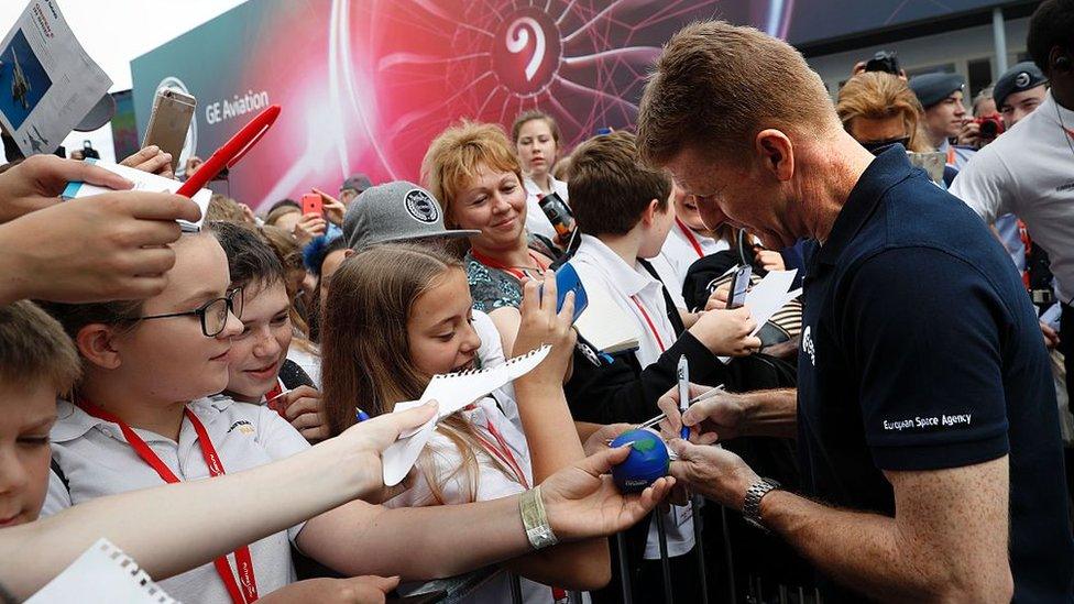 Tim Peake signing children's authographs