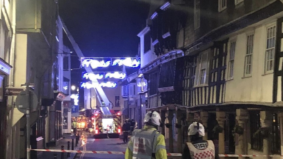 Fire engine in the street with aerial ladder