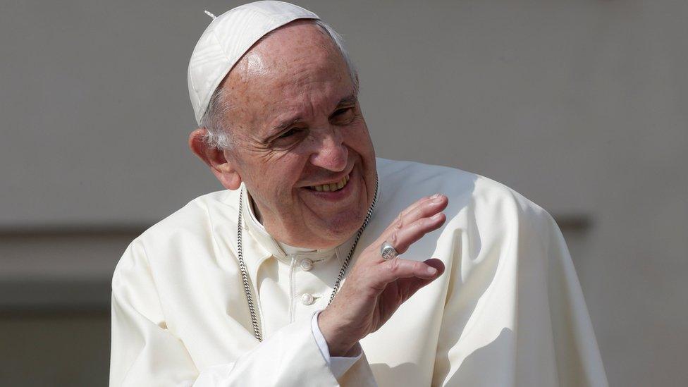 Pope Francis waves during his general audience in Saint Peter's square at the Vatican, on 14 June