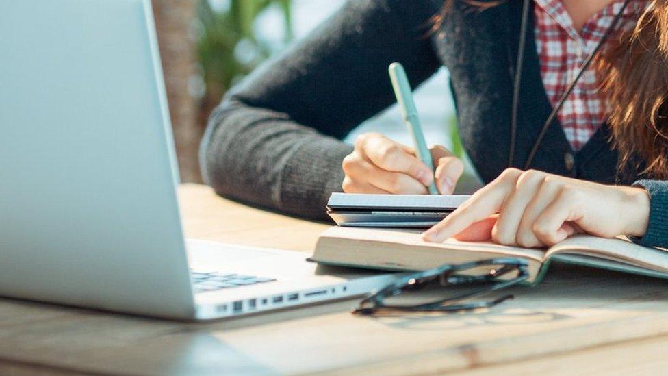 Stock image of woman working at laptop