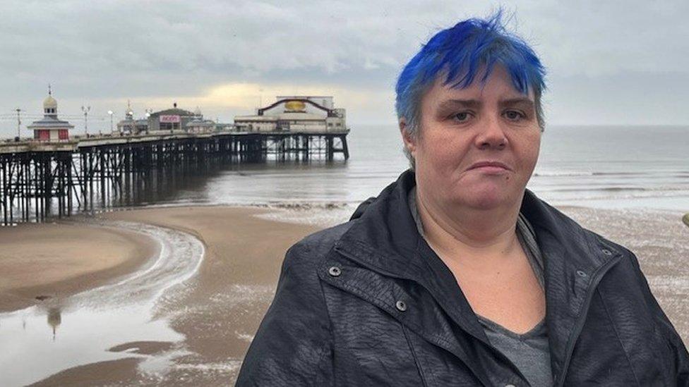 Eve at Blackpool beach with the pier behind her