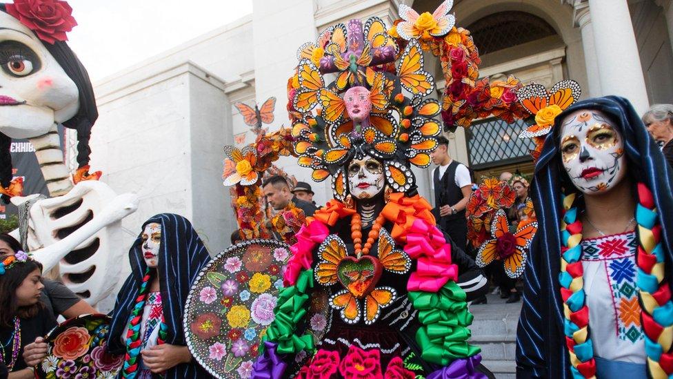 People take part in Dia de Los Muertos in Hollywood, California