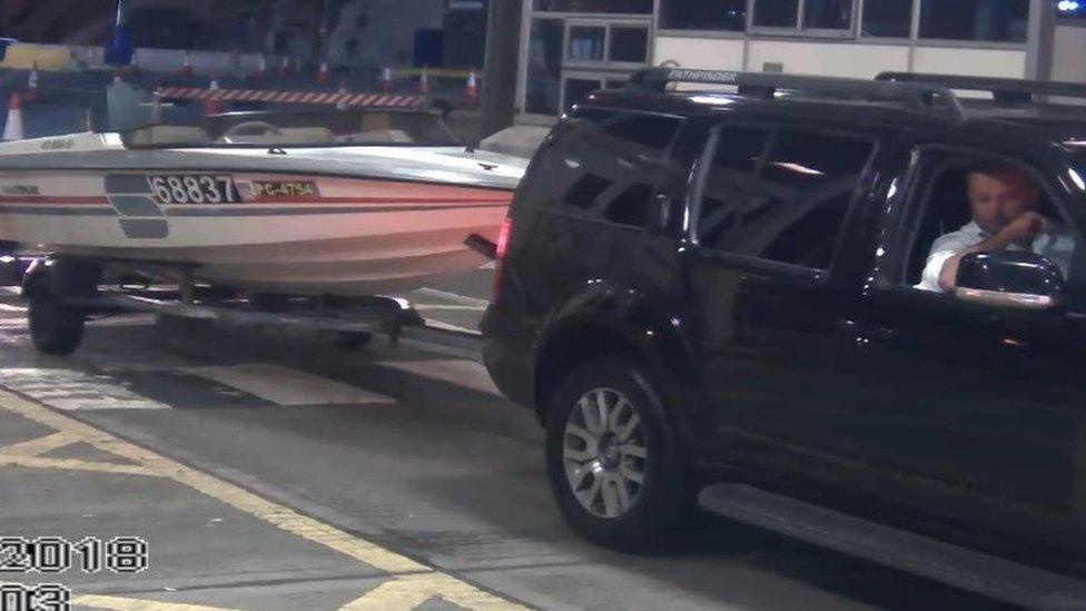 Car towing a speedboat smuggling three people into the UK