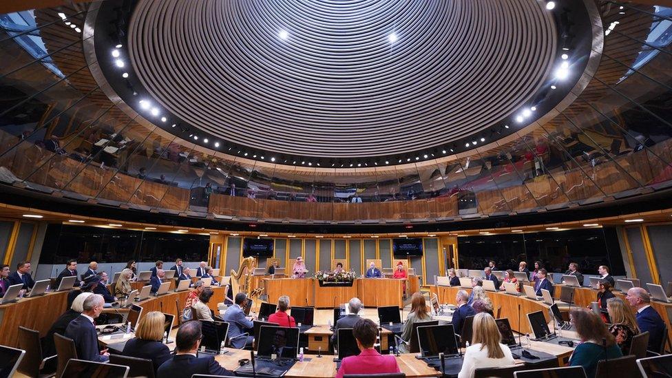 Queen Elizabeth II addresses the chamber during the ceremonial opening of the sixth Senedd