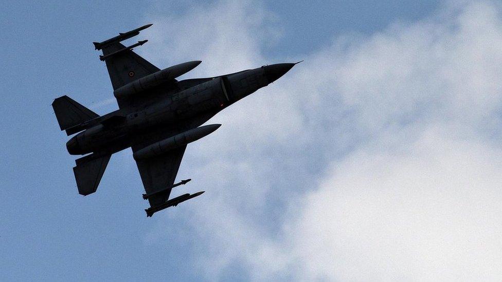 A Turkish jet flies above the Incirlik base