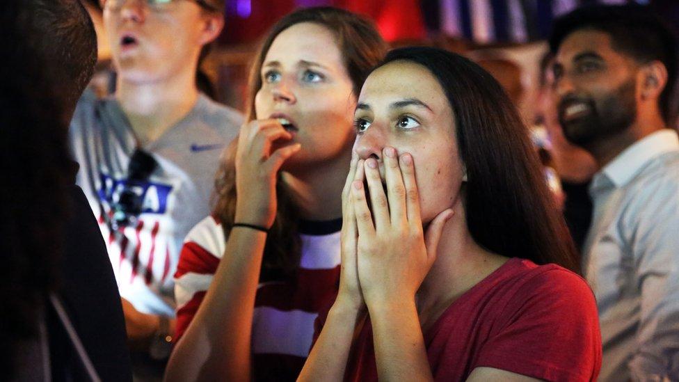 Two women watch a dramatic moment during the World Cup semi-final