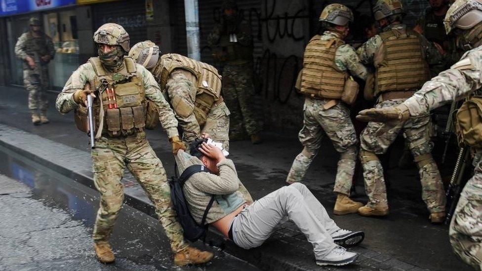 Security forces detain a demonstrator during anti-government protests, in Concepcion, Chile October 26, 2019.