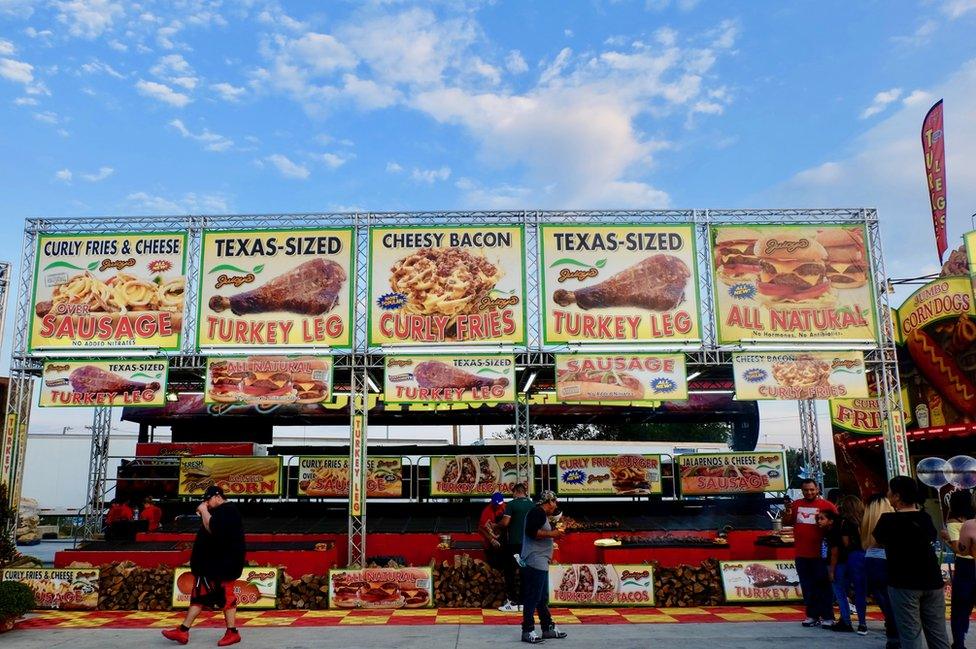 A stand advertising different variations of Turkey legs