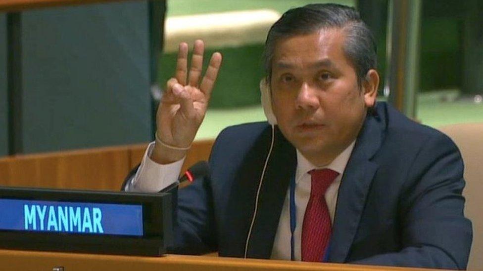 Myanmar's ambassador to the United Nations Kyaw Moe Tun holds up three fingers