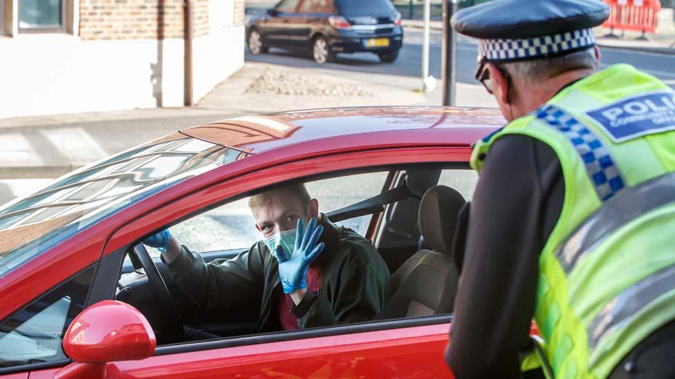 Police at a vehicle checkpoint in York