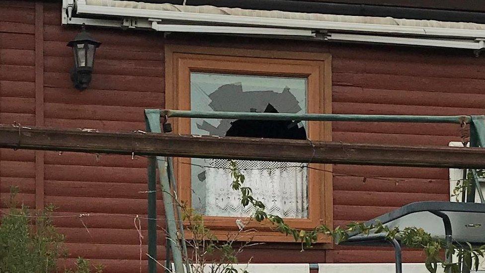 Smashed bathroom window in chalet