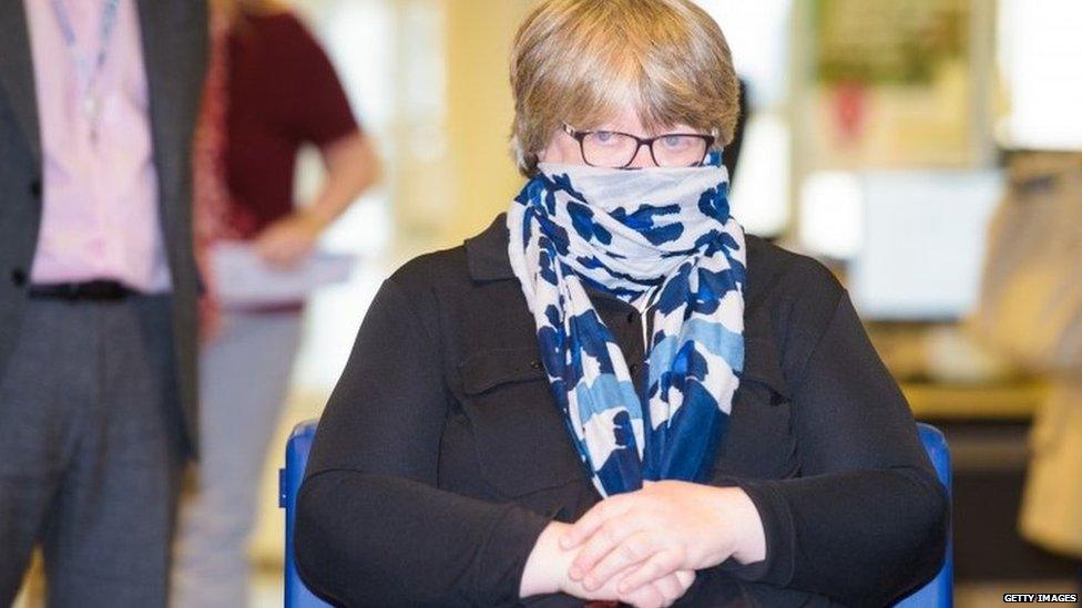 Therese Coffey wears a face covering during a visit to a job centre earlier this month