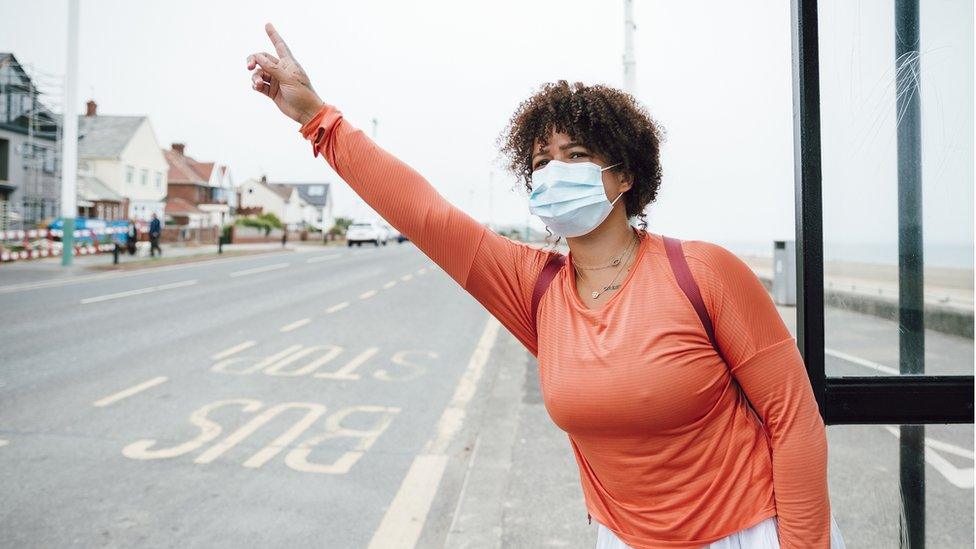 Woman at bus stop in Sunderland (stock image)