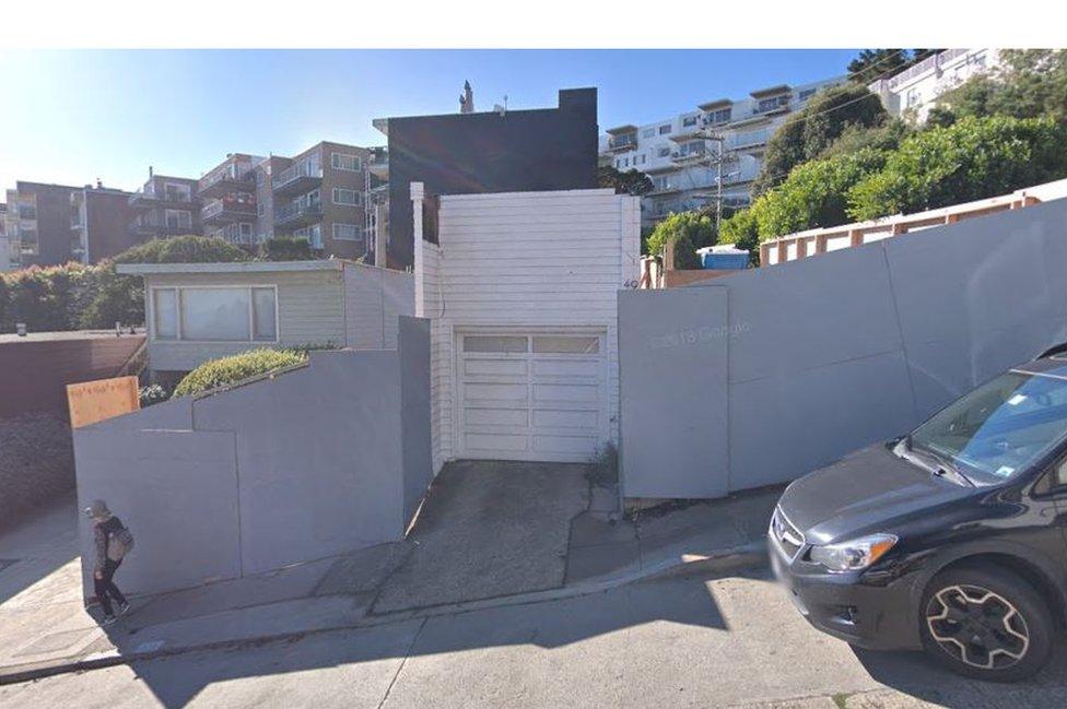 A streetview picture of the house as it looked in 2017 - surrounded by construction boards