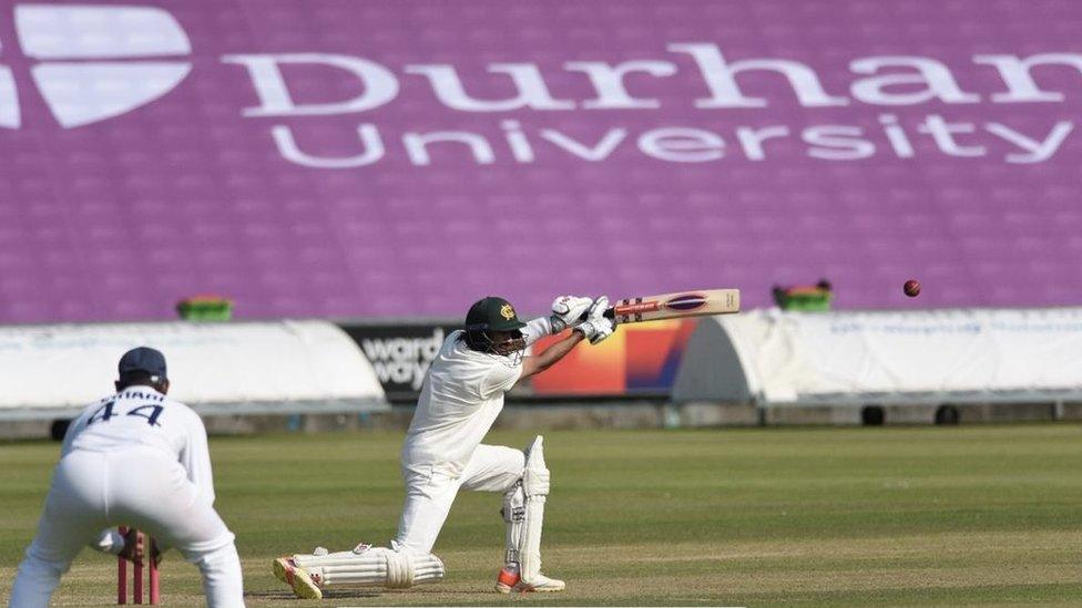 Students playing cricket