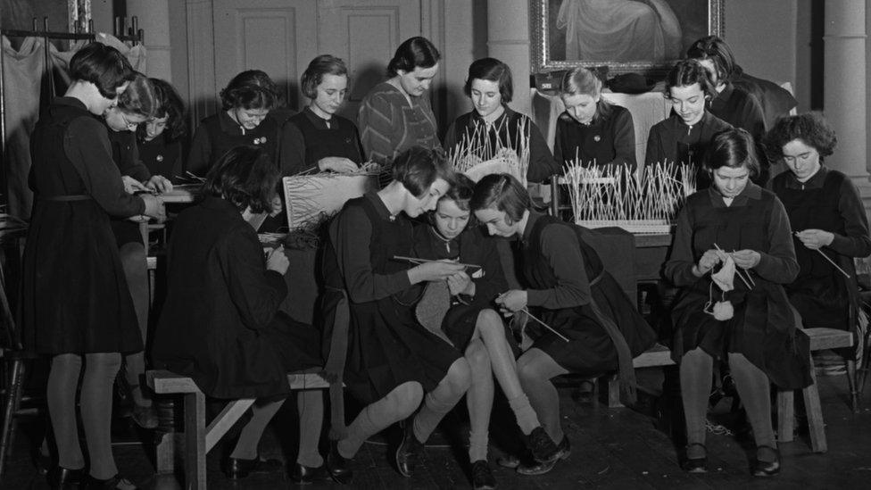 Black and white photos showing school girls knitting