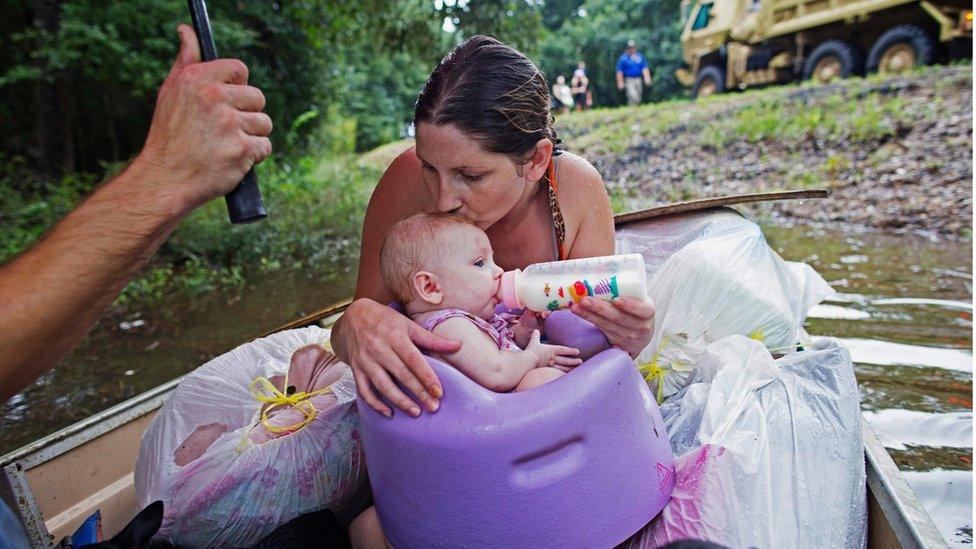 Mother and child in flood