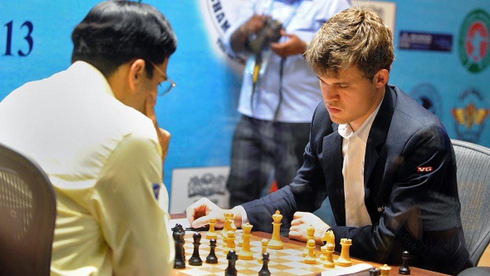 Norway's Magnus Carlsen competes in the 10th championship chess match with India's Vishwanath Anand in Chennai on November 22, 2013