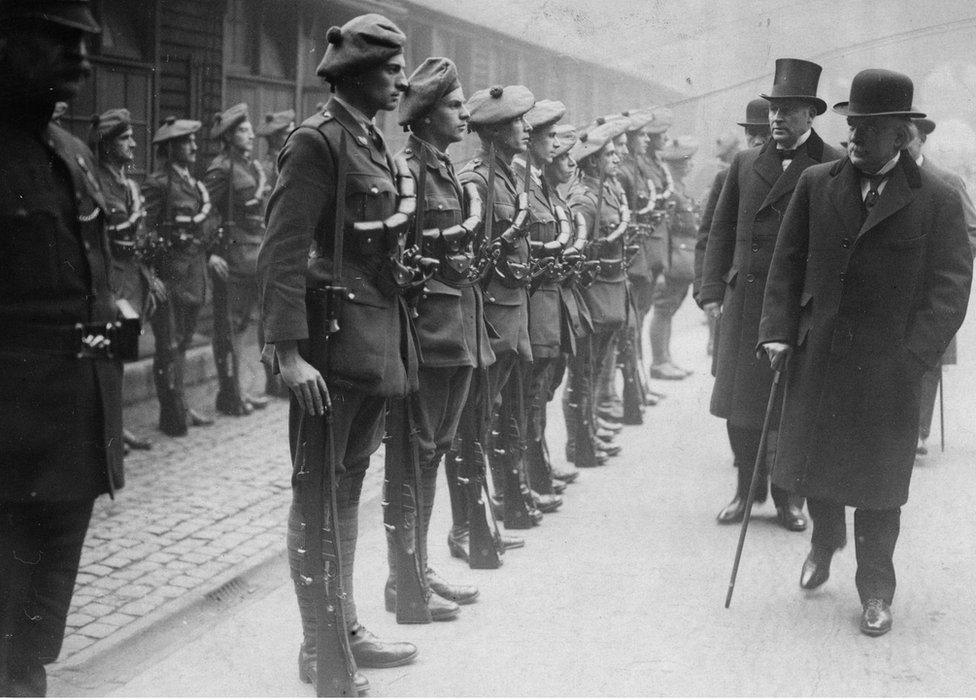 British PM David Lloyd George inspecting officer cadets of the auxiliary division of the RIC in 1920