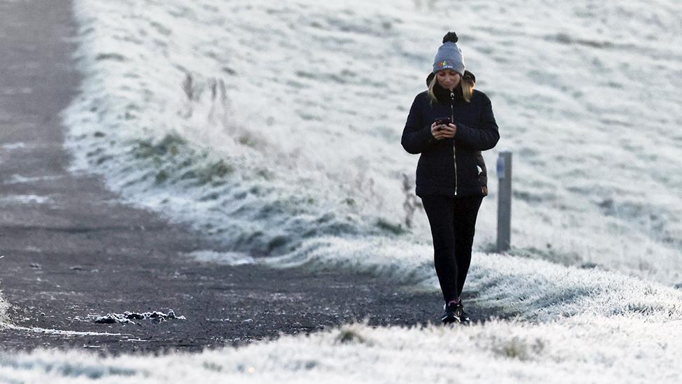 A person walks in Epsom, Surrey on Dec 8, 2022