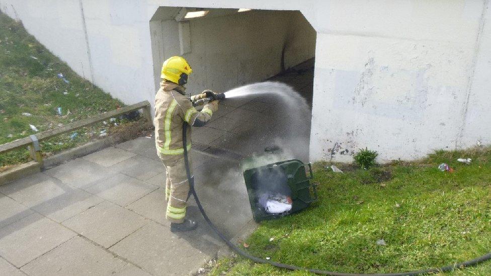 Firefighter putting out blaze