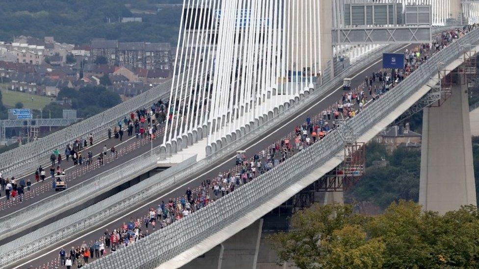 Walkers on bridge