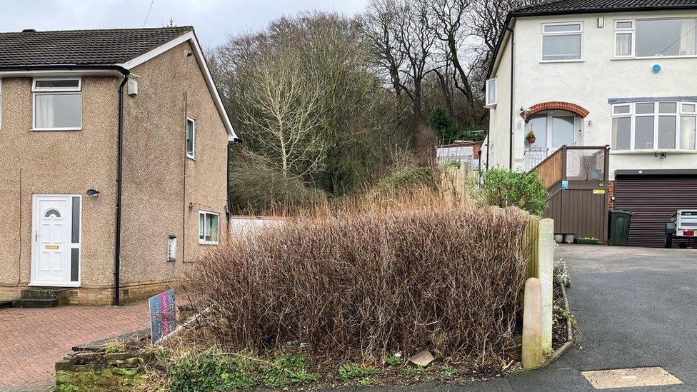 The piece of land the two homes on the Nab Wood Street