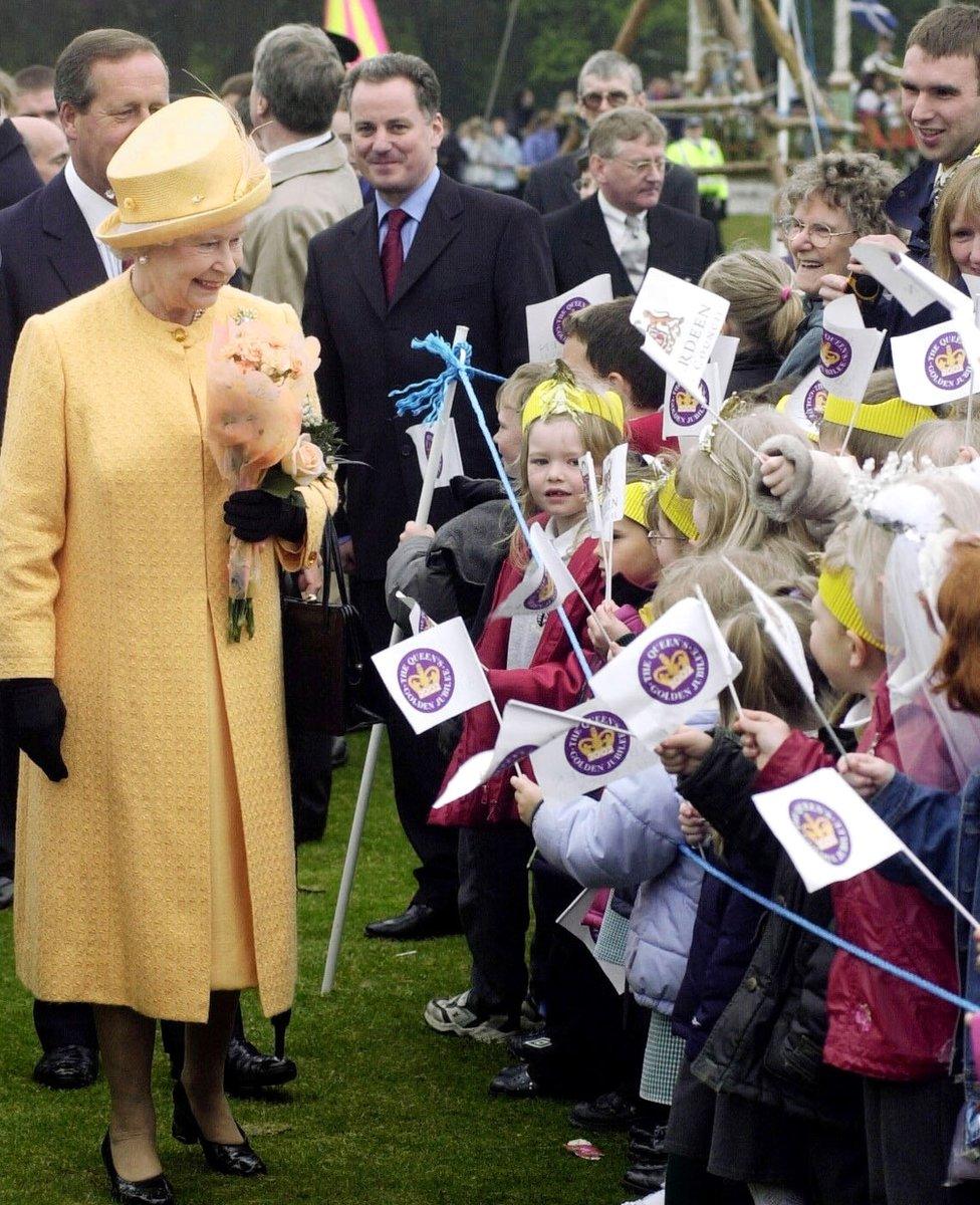 Queen Elizabeth Is Greeted By School Children With Scotland's First Minister Jack McConnell (centre Left) Looking On At Duthie Park, Aberdeen.