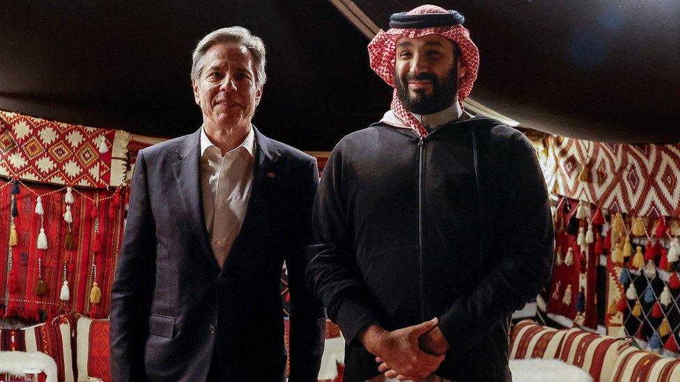 US Secretary of State Antony Blinken (L) and Saudi Crown Prince Mohammed bin Salman in a tent at al-Ula, in Saudi Arabia (8 January 2024)