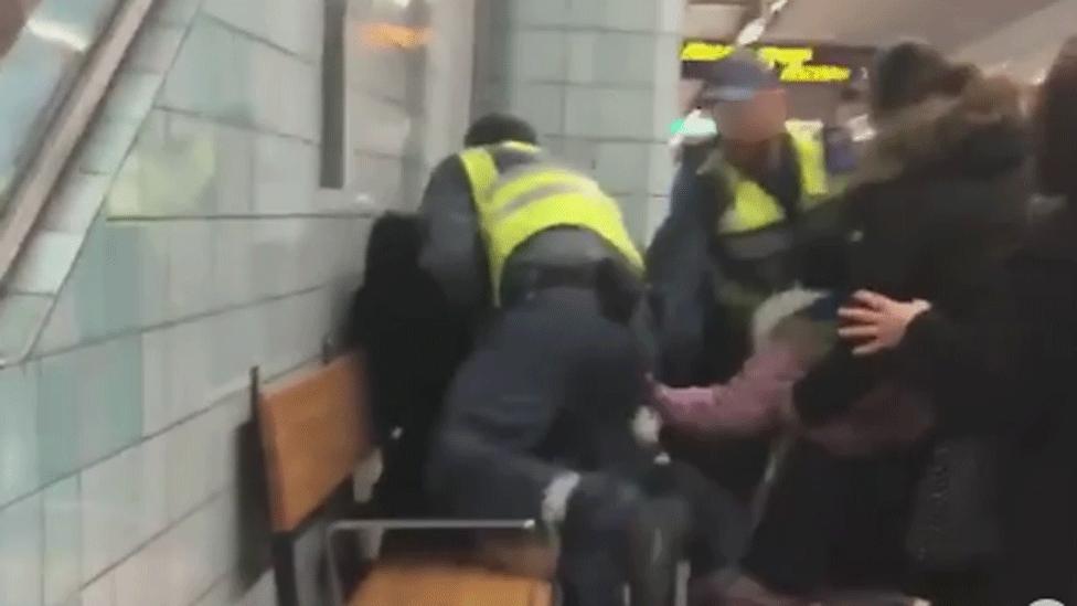 Video grab of the woman being overpowered on the Stockholm metro