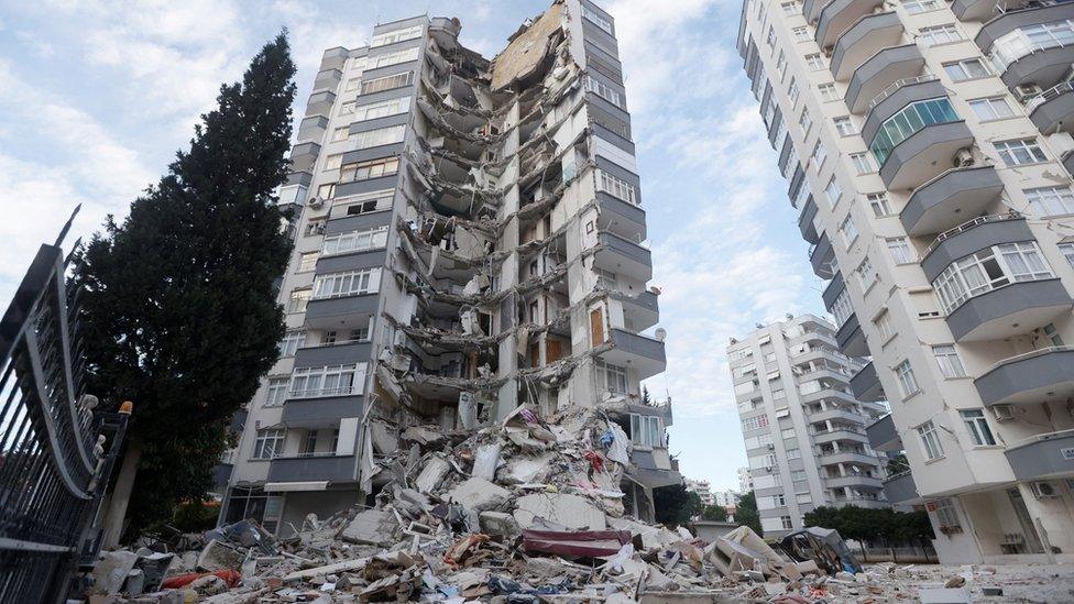 A view shows a semi collapsed building following the earthquake in Adana, Turkey