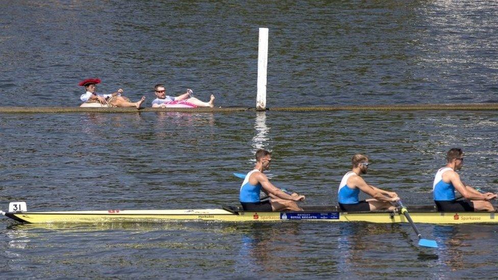 Spectators on inflatables at Henley regatta