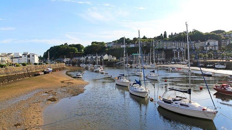 Yachts in Porthmadog harbor marina low tide