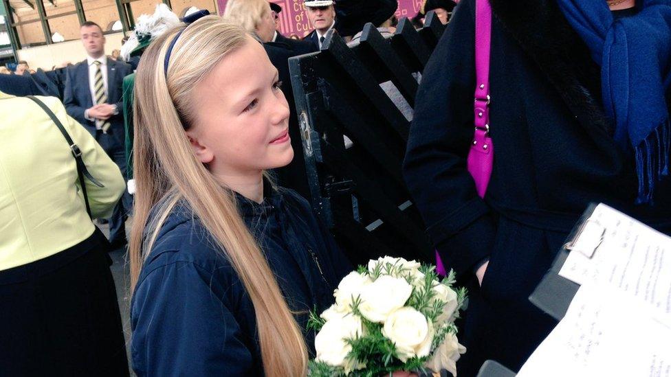 Girl holding a posy